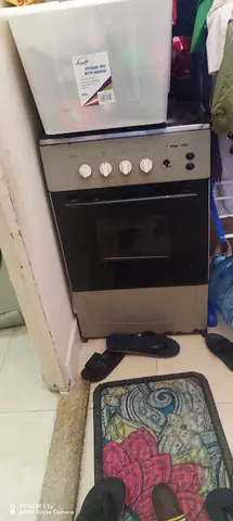 Used freestanding gas stove with 4 burners - working condition
