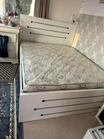 Looks Like a new king size Bed with mattresses for sale
