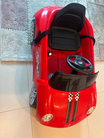 Red ride-on electric toy car for toddlers, single seat