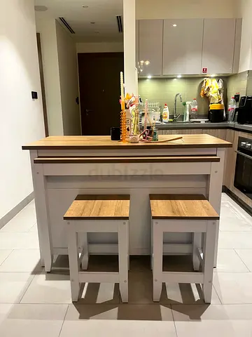 Stylish white & oak kitchen island with 2 stools and pull-out dining table. Great space-saving piece