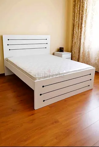 Queen size bed with mattress selling brand new
