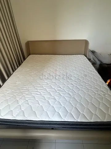 Beige upholstered double bed frame with mattress - good condition