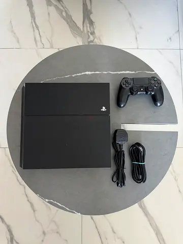 PlayStation 4 (PS4) with DualShock 4 controller - Good working condition