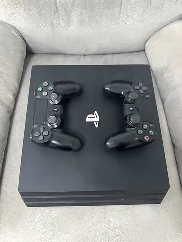 PlayStation 4 Pro with 2 DualShock 4 Controllers - Good Condition