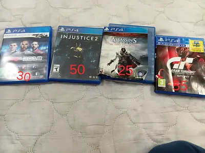 Bundle of 4 PS4 Games - F1 2018, Injustice 2, Assassin's Creed Ezio Collection, Gran Turismo Sport