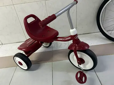 Classic red toddler tricycle - sturdy and gently used