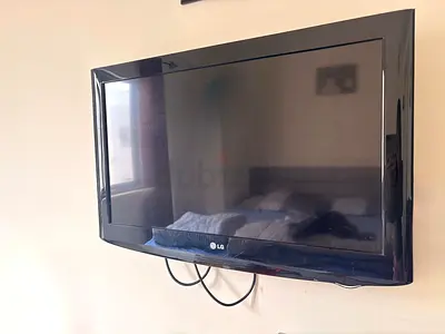 LG 32-inch LED TV wall-mounted in good working condition
