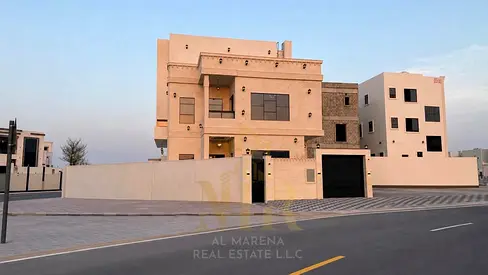Luxury villa for sale in Al Helio 2 – Ajman | 5 master bedrooms | 2 floors + roof | Swimming pool | Price includes registration and ownership fees
