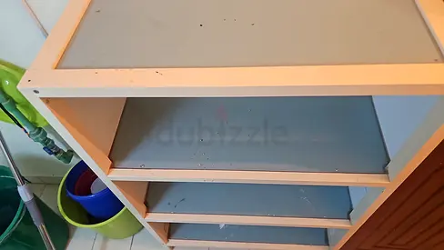 Compact white/green wooden shelving unit - good for storage or bedroom