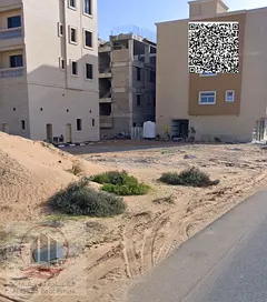 Land for sale in Al Alia, Ajman, Hamid City area. Land permit: residential/commercial.