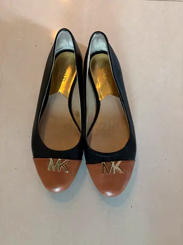 Michael Kors black leather flats with tan cap toe - size 9M