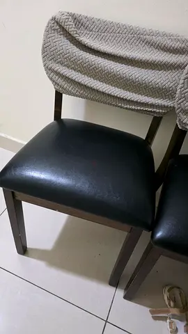 Set of 4 dark wood dining chairs with black faux leather seats