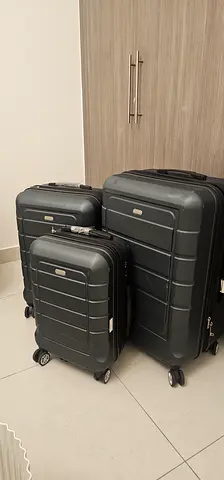 Showkoo 3-piece black hard-shell rolling luggage set - excellent condition!