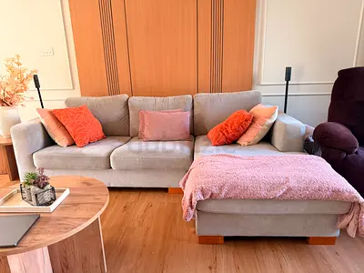 Light grey 3-seater sofa with chaise lounge, good condition 1.5 years. Moving out sale. 400 dhs