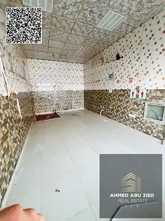Commercial shop for annual rent on main road in Al Rawda 2; suitable for all business activities, wi