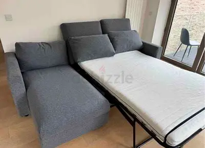 Grey L-Shaped Sofa Bed with Pull Out Mattress