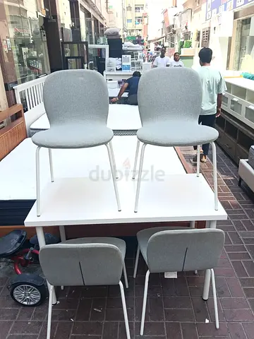 Set of 4 modern grey fabric dining chairs with white metal legs