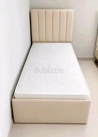 Selling brand new single bed with mattresses