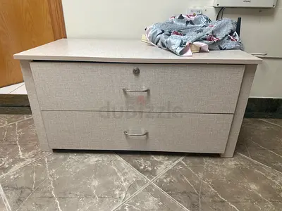 Light grey two-drawer storage chest / low cabinet