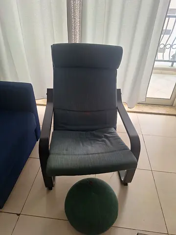Light blue upholstered reclining armchair with wooden frame