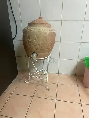Small clay pot water dispenser with stand