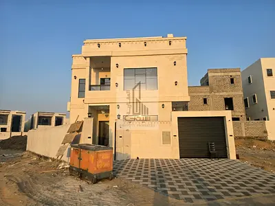 Luxury classic villa for sale in Al Helio – Ajman | Opposite Al Basateen Park | With swimming pool, central air conditioning, and all fees included |