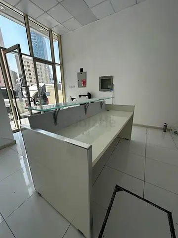 White glass-topped reception desk / office counter - good condition