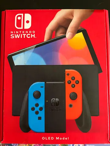 Nintendo Switch OLED (Neon) in original box - Good condition