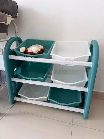 Small plastic baby nursery storage shelf with bins - teal/white