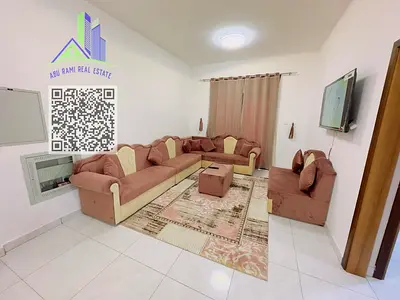 Newly furnished 1-bedroom apartment in Al Rashidiya 2, with balcony and central AC, behind Al Rashi