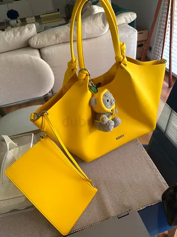Yellow DKNY PAULA medium tote bag with detachable pouch and Bear charm keychain - good condition