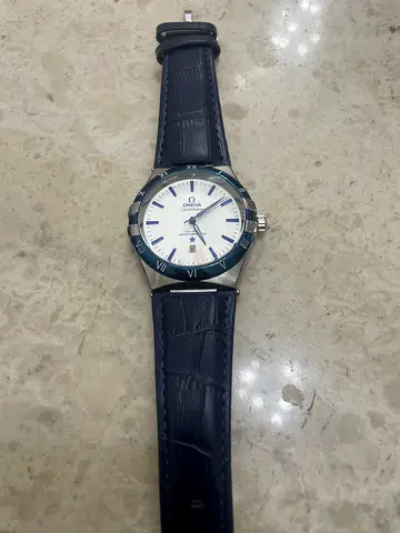 Omega constellation men's watch with white dial and blue leather strap