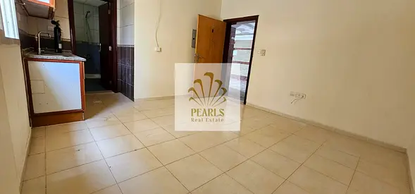 Spacious Studio for Annual Rent in Al Nuaimiya 3, Ajman, with a Semi-Separate Kitchen and Bathroom