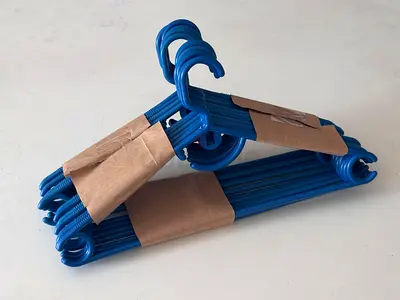 Set of blue plastic clothes hangers - 14 pieces