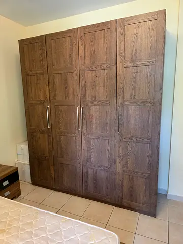Large solid wood 4-door wardrobe/armoire - good condition