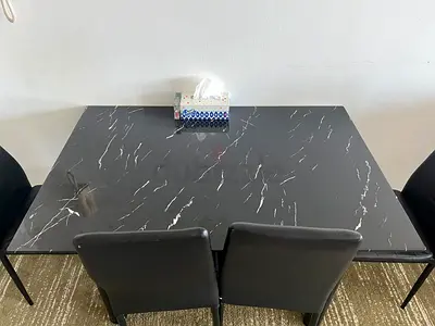 Modern black marble-effect dining table with 4 chairs