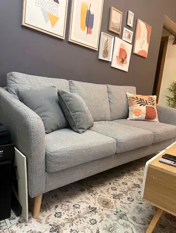 Light grey 3-seater fabric sofa in good condition