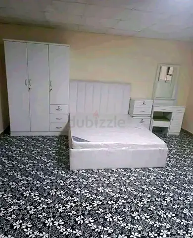Excellent condition brand new bed with side table and dressing table and with 3 door wardrobe