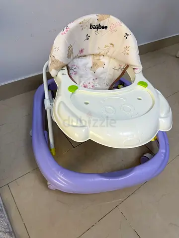 Lightly used Baybee baby walker with tray and padded seat