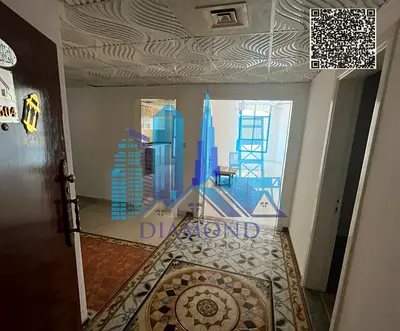 Vacant apartment for sale featuring 3 bedrooms, a living room, and a maid's room, with a view of Ajman Creek, located in Al Khor Towers, Ajman.