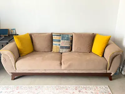 Beige 3-Seater Sofa with Wooden Base and Yellow Accent Cushions