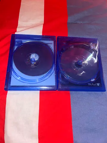 Two PS4 game discs in cases (no labels)