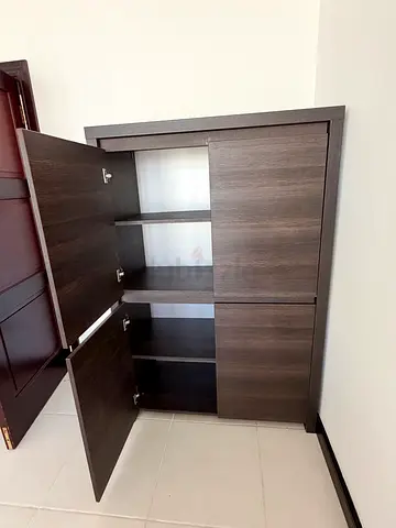 Solid Dark wood wall-mounted cabinet with drop-down doors.