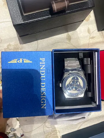 Pindu Design men's wristwatch with metal bracelet - like new in box
