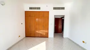 SPACIOUS 1 BHK/ 2 BATH/ COVERED PARKING / HUB CANAL 1 / UNFURNISHED/NO COMMISSION/DUBAI SPORTS CITY