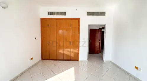 SPACIOUS 1 BHK/ 2 BATH/ COVERED PARKING / HUB CANAL 1 / UNFURNISHED/NO COMMISSION/DUBAI SPORTS CITY