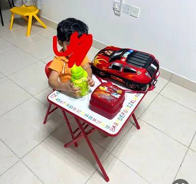 Kids foldable study table and chair set with car-themed backpack