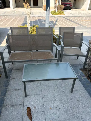 Outdoor patio set - 4single  chairs, one double chair and glass-top coffee table