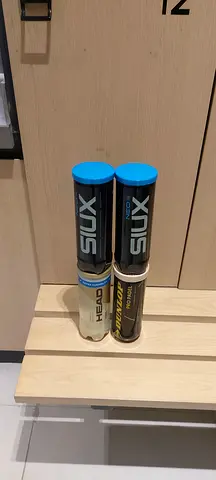 Two cans of Head and Dunlop tennis balls - unopened