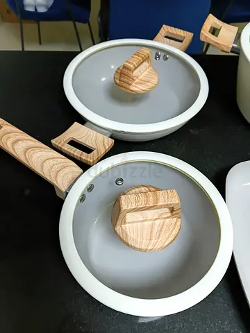 Set of 4 non-stick saucepans with glass lids and wooden handles — used